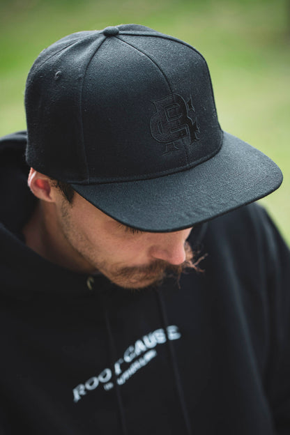 Root Cause Branded Black Snap Back Cap